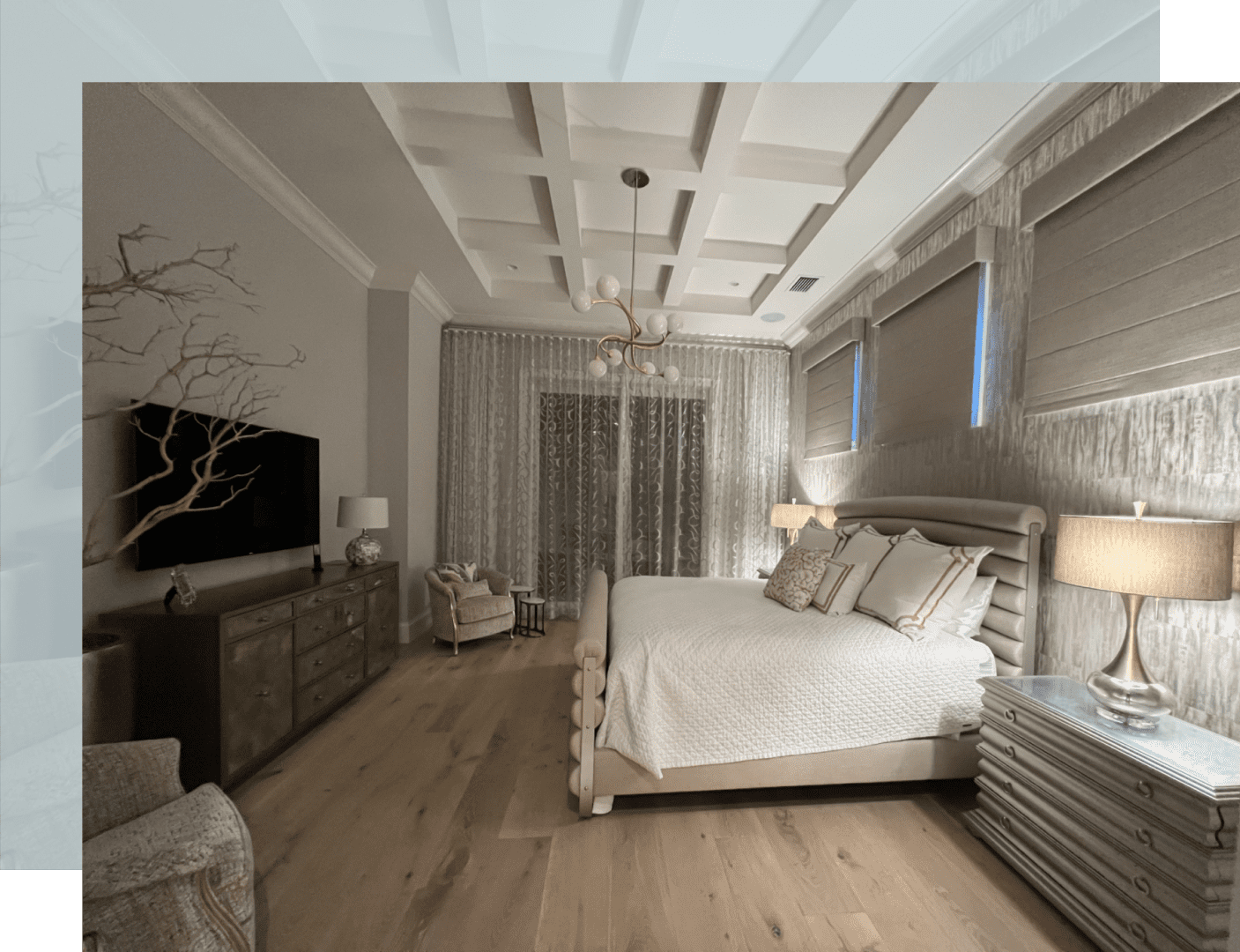 A bedroom with a bed, dresser and tv.